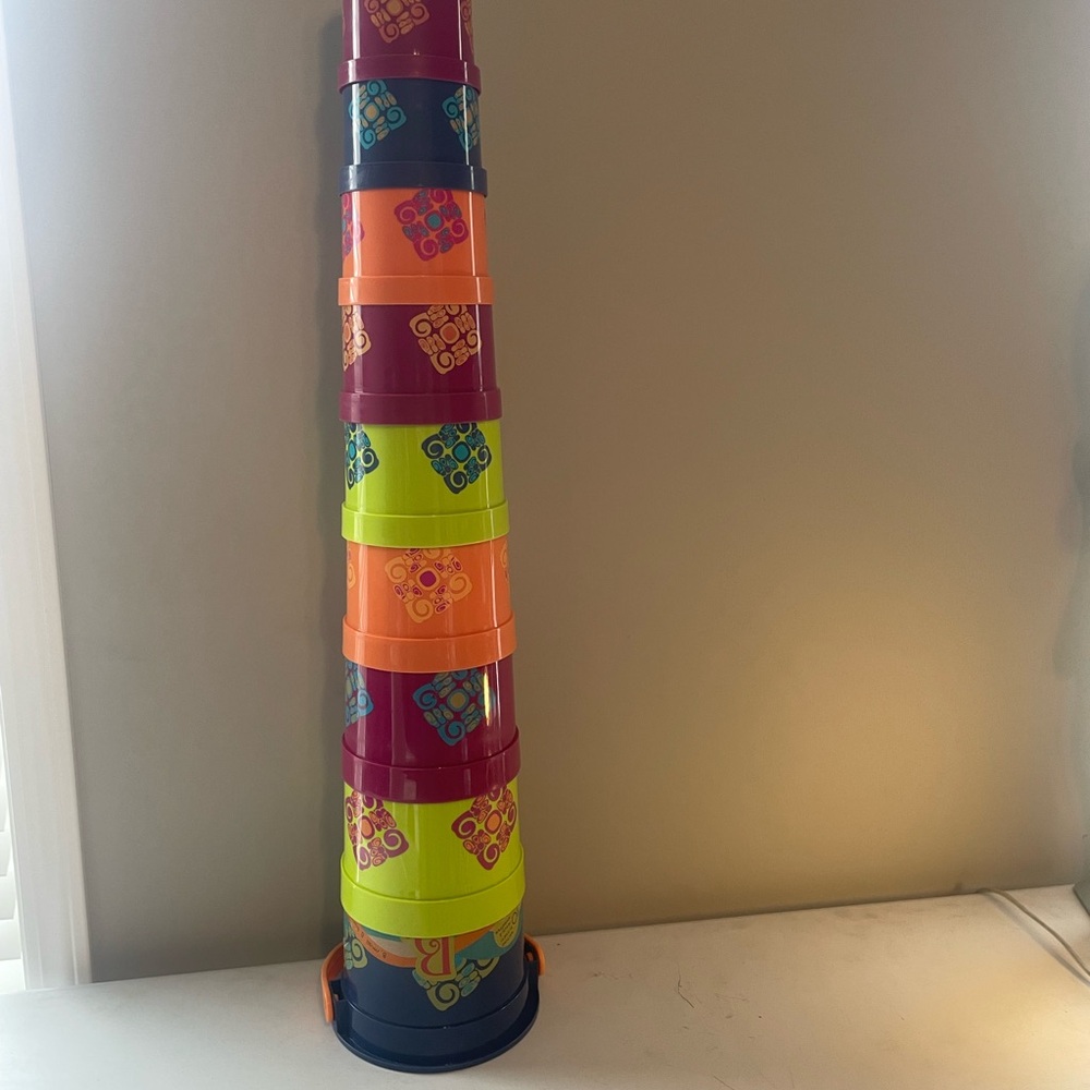 B. Toys nesting and stacking buckets
